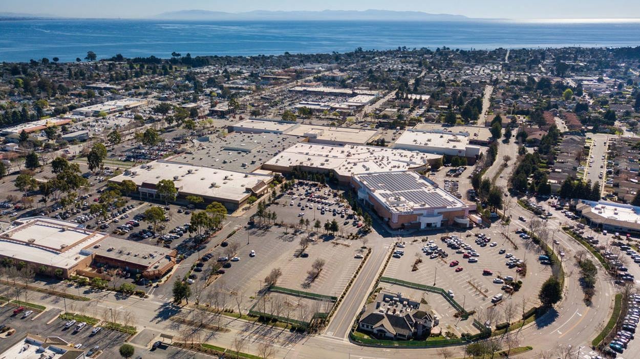 Aerial photo of existing Capitola Mall with Monterey Bay in the background